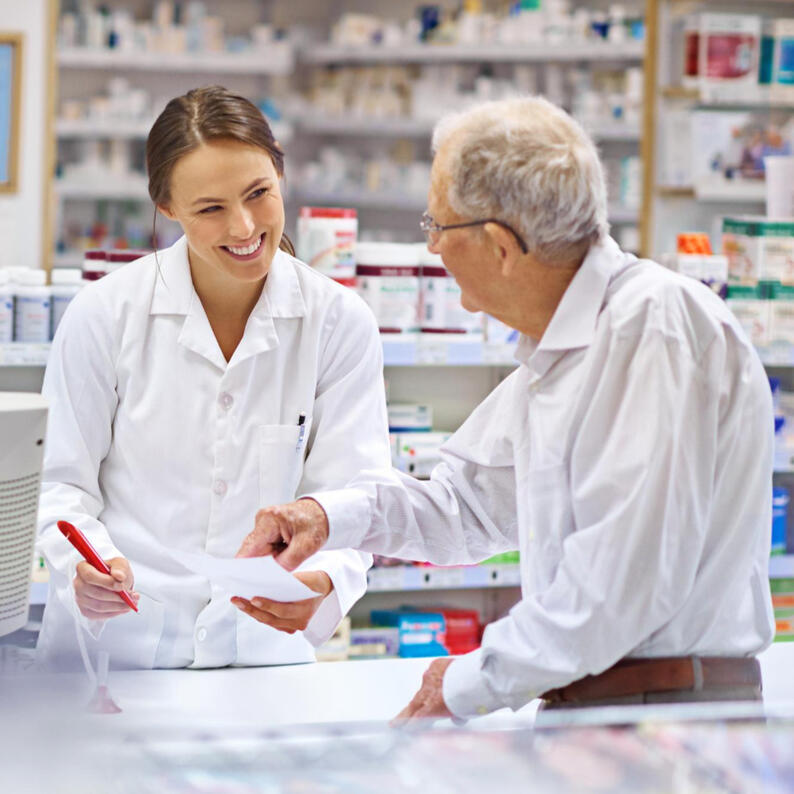 Pharmacist consulting patient